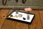 Nature's Mark Mini Zen Garden Kit for Desk with Rake, White Sand, Buddha, Lantern, Black Rectangle Base, River Rocks and Mini Blossom Tree (8Lx5W C) - Image 5
