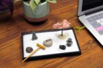 Nature's Mark Mini Zen Garden Kit for Desk with Rake, White Sand, Buddha, Lantern, Black Rectangle Base, River Rocks and Mini Blossom Tree (8Lx5W C) - Image 4